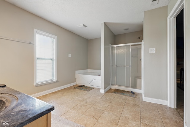 621 Fireside Dr, Greenwood, IN 46143 - bathroom with a shower stall, a bath, vanity, tile patterned floors, and a textured ceiling