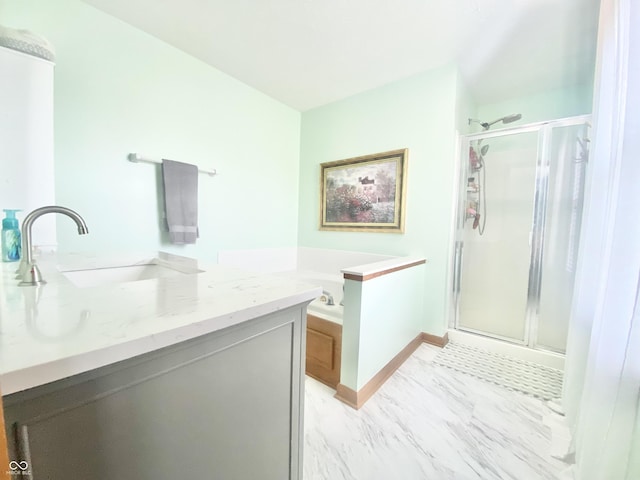 bathroom with a shower stall, a garden tub, and a sink