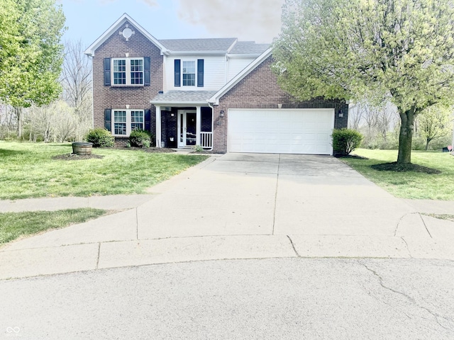traditional-style house with brick siding, an attached garage, a front yard, and concrete driveway
