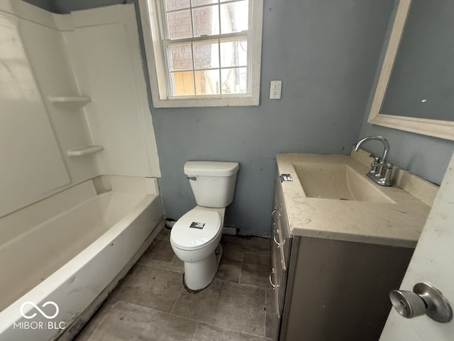 full bath featuring vanity, tile patterned flooring, and toilet
