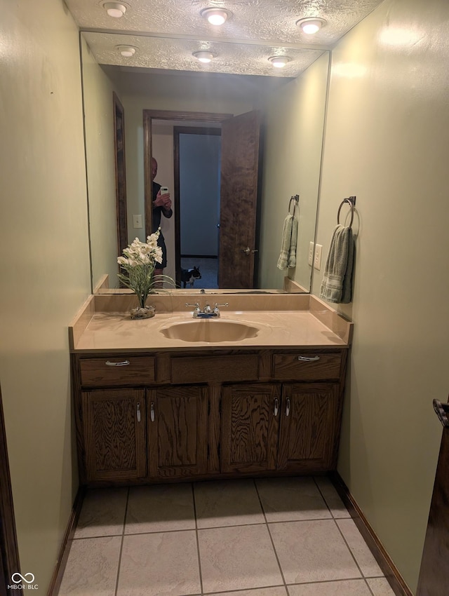 8017 Dogwood Ct, Plainfield, IN 46168 - bathroom with vanity, a textured ceiling, and tile patterned flooring
