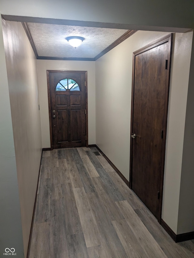 8017 Dogwood Ct, Plainfield, IN 46168 - entryway with a textured ceiling, crown molding, and wood finished floors