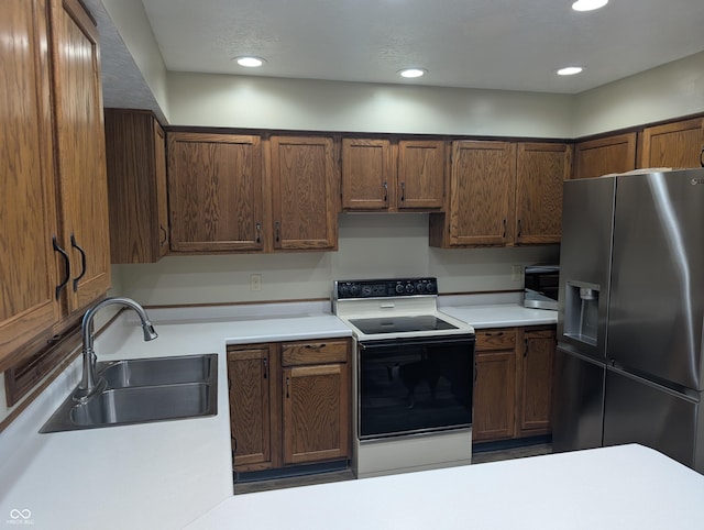 8017 Dogwood Ct, Plainfield, IN 46168 - kitchen with stainless steel fridge, electric range, light countertops, and recessed lighting