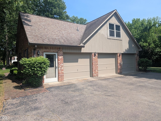 8017 Dogwood Ct, Plainfield, IN 46168 - view of front of house with brick siding, roof with shingles, and driveway