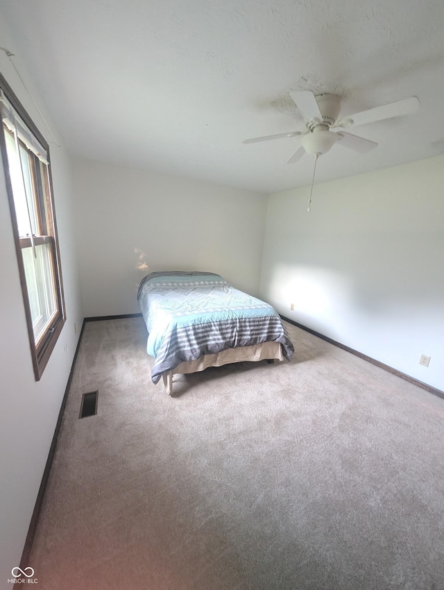 8017 Dogwood Ct, Plainfield, IN 46168 - carpeted bedroom with baseboards and a ceiling fan