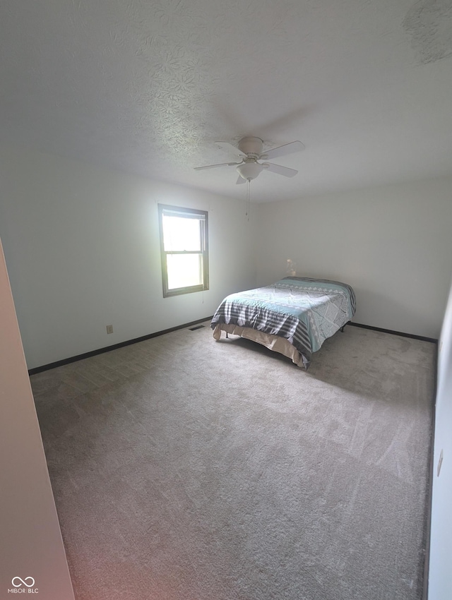8017 Dogwood Ct, Plainfield, IN 46168 - bedroom with a ceiling fan, carpet floors, and a textured ceiling