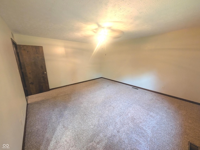8017 Dogwood Ct, Plainfield, IN 46168 - empty room with a textured ceiling, carpet, and ceiling fan