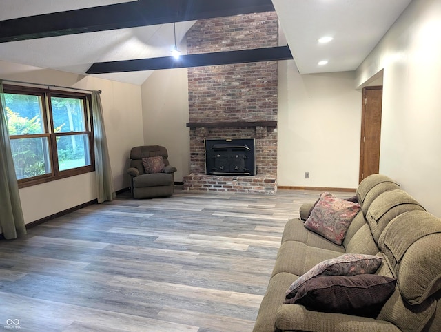 8017 Dogwood Ct, Plainfield, IN 46168 - living area with wood finished floors, a brick fireplace, and recessed lighting