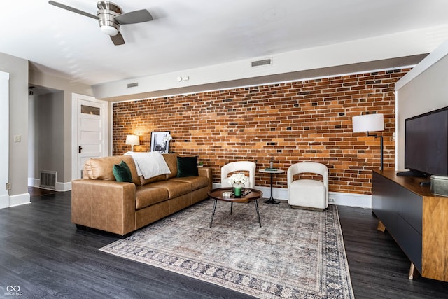 801 N Pennsylvania St Apt D, Indianapolis, IN 46204 - living room featuring brick wall, baseboards, a ceiling fan, and wood finished floors