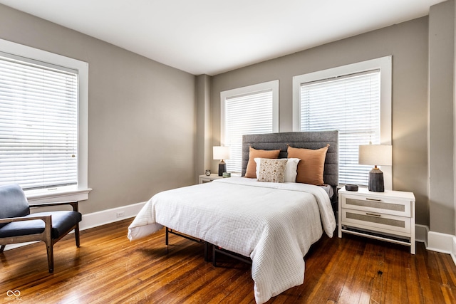 801 N Pennsylvania St Apt D, Indianapolis, IN 46204 - bedroom with baseboards and hardwood / wood-style floors