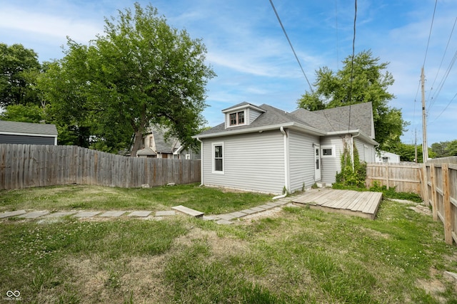 view of yard featuring a fenced backyard and a deck