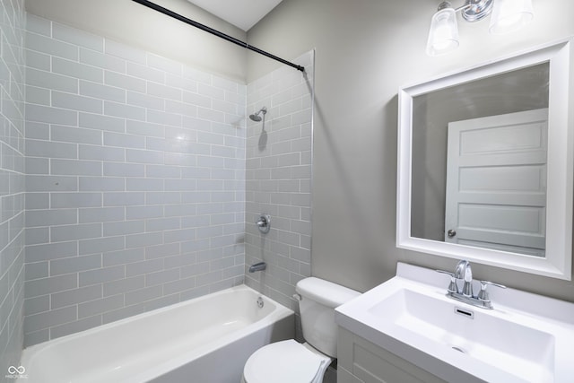 bathroom featuring toilet, shower / bathtub combination, and vanity