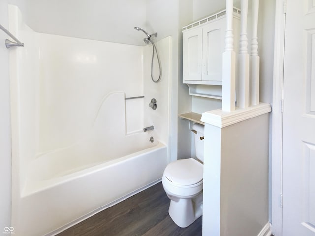 9162 Hadway Dr, Indianapolis, IN 46256 - bathroom featuring wood finished floors, toilet, and bathtub / shower combination