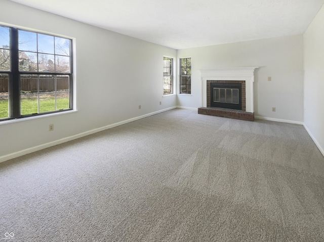 9162 Hadway Dr, Indianapolis, IN 46256 - unfurnished living room with a brick fireplace, baseboards, and carpet flooring