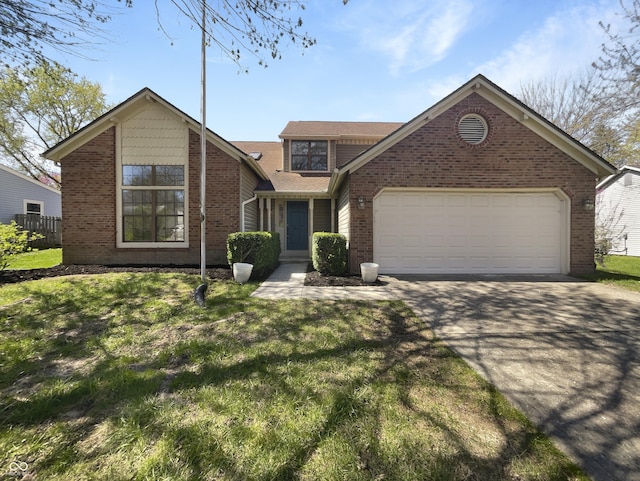 9162 Hadway Dr, Indianapolis, IN 46256 - traditional-style home featuring a front lawn, driveway, brick siding, and a garage
