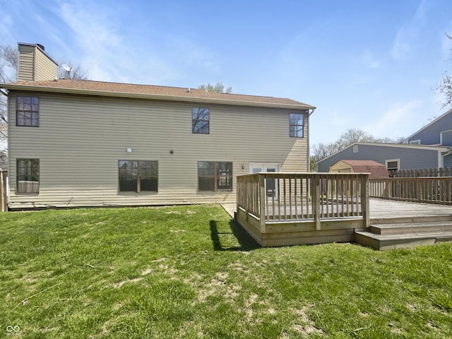 9162 Hadway Dr, Indianapolis, IN 46256 - rear view of property with a wooden deck, a lawn, and a chimney