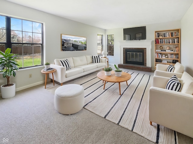 9162 Hadway Dr, Indianapolis, IN 46256 - carpeted living room with baseboards, a healthy amount of sunlight, and a fireplace