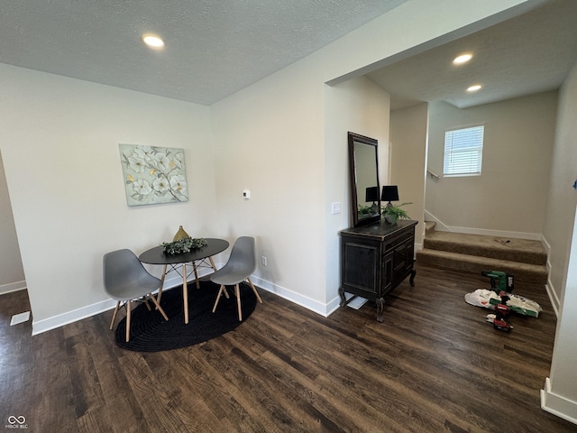 dining area with baseboards, wood finished floors, recessed lighting, and stairway