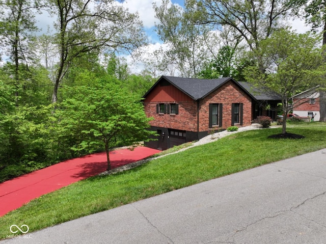 view of front facade featuring brick siding, an attached garage, a front yard, and roof with shingles