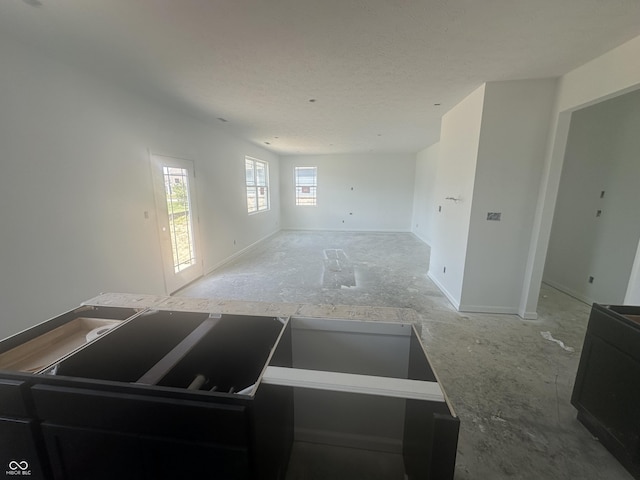 1656 Winn Ct, Fortville, IN 46040 - unfurnished living room with baseboards