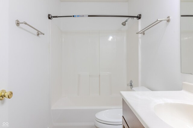 bathroom featuring toilet, shower / washtub combination, and vanity