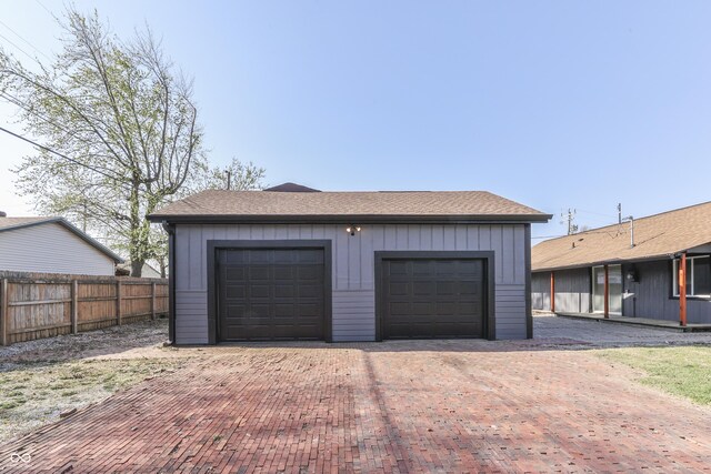 91 Crestview Dr, Greenwood, IN 46143 - garage featuring fence and decorative driveway
