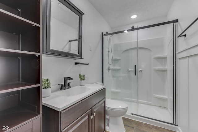 91 Crestview Dr, Greenwood, IN 46143 - full bathroom with vanity, wood finished floors, a shower stall, and toilet