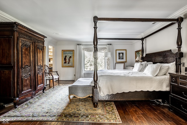 bedroom featuring hardwood / wood-style flooring and crown molding