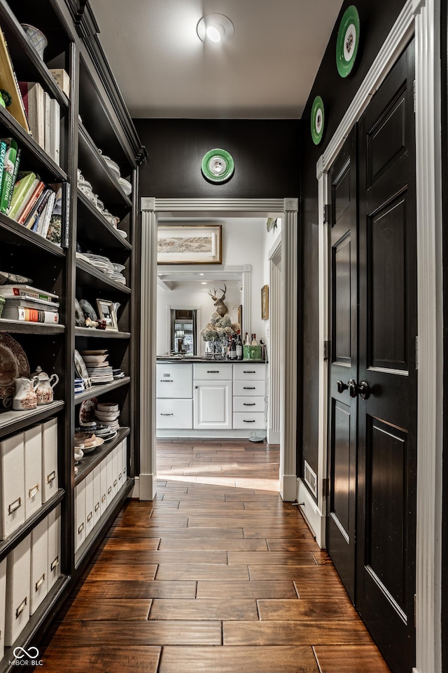 spacious closet featuring dark wood-style floors