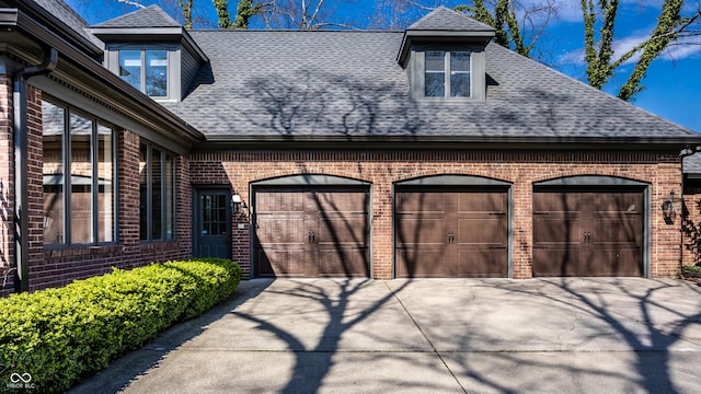 garage featuring driveway
