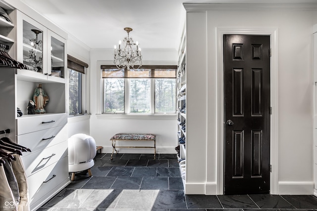 spacious closet with an inviting chandelier