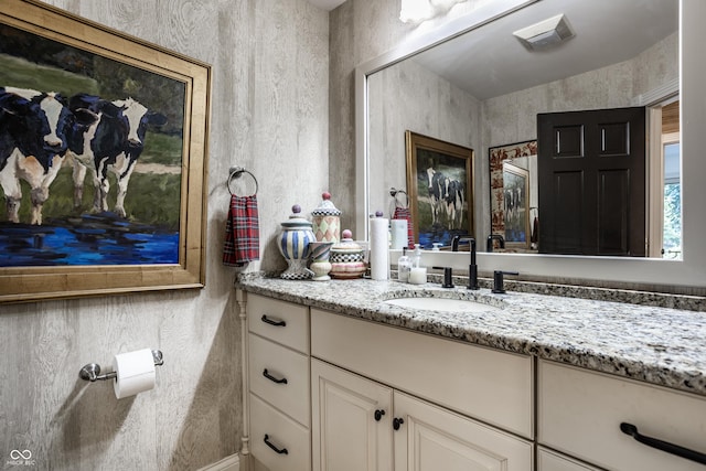 bathroom featuring visible vents and vanity