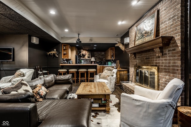 living room featuring bar area and a fireplace