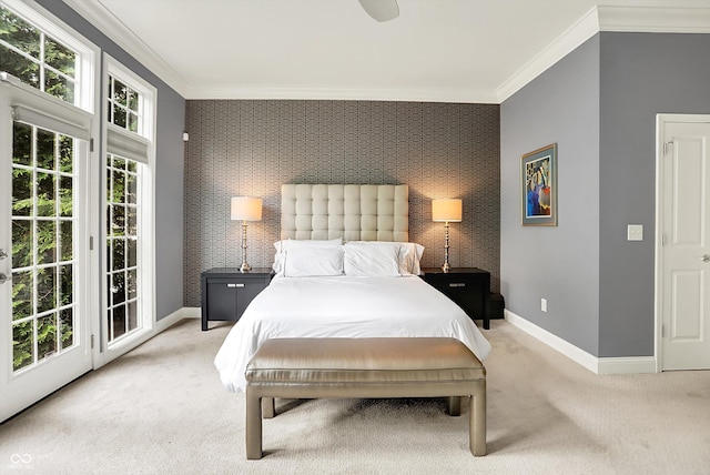 bedroom featuring an accent wall, carpet, ornamental molding, baseboards, and access to outside