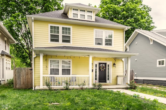 3133 Ruckle St, Indianapolis, IN 46205 - traditional style home featuring a porch and roof with shingles