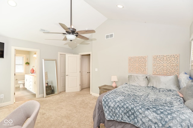 bedroom with high vaulted ceiling, light carpet, visible vents, and baseboards