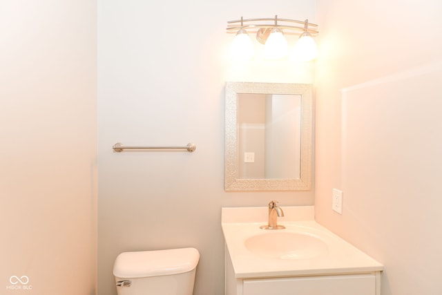 bathroom with toilet and vanity