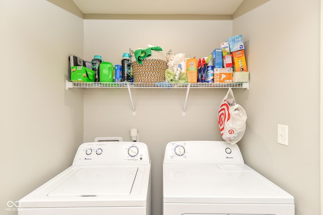 laundry area with washing machine and dryer and laundry area
