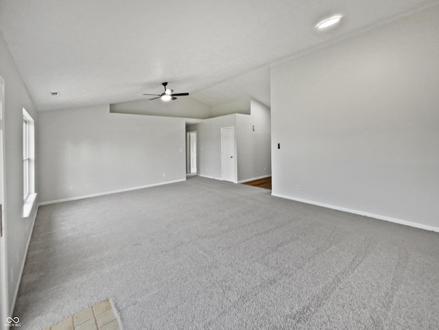 491 Westview Dr, Bargersville, IN 46106 - unfurnished living room with lofted ceiling, carpet floors, a ceiling fan, and baseboards