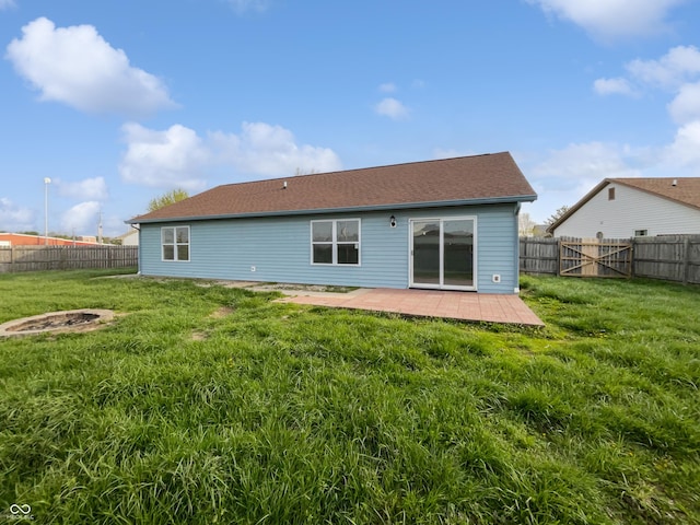 491 Westview Dr, Bargersville, IN 46106 - rear view of house with a fenced backyard, a yard, a shingled roof, and an outdoor fire pit