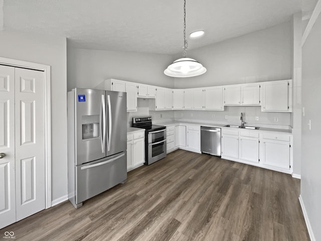 491 Westview Dr, Bargersville, IN 46106 - kitchen with light countertops, a sink, baseboards, appliances with stainless steel finishes, and white cabinetry