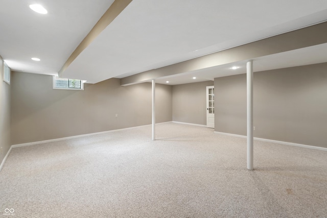 below grade area with carpet floors, recessed lighting, and baseboards