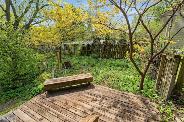 deck with a fenced backyard