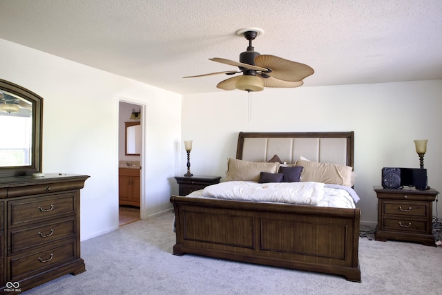 5236 Skipping Stone Dr, Indianapolis, IN 46237 - bedroom with connected bathroom, a textured ceiling, ceiling fan, and light colored carpet