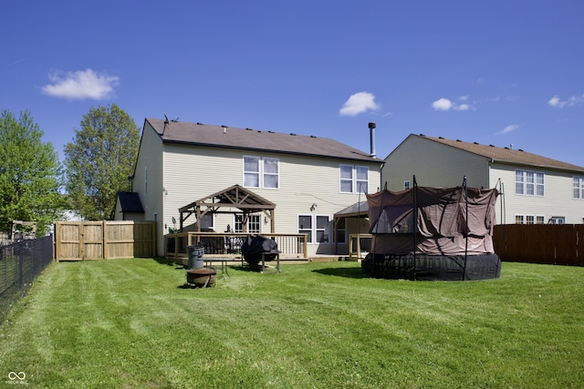 5236 Skipping Stone Dr, Indianapolis, IN 46237 - back of property with a lawn, a deck, a gazebo, and a fenced backyard