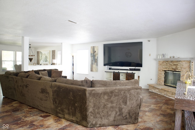 5236 Skipping Stone Dr, Indianapolis, IN 46237 - living area featuring stone finish floor, visible vents, and a stone fireplace
