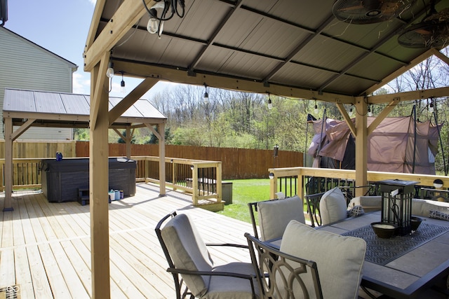5236 Skipping Stone Dr, Indianapolis, IN 46237 - wooden terrace with ceiling fan, a fenced backyard, and a hot tub