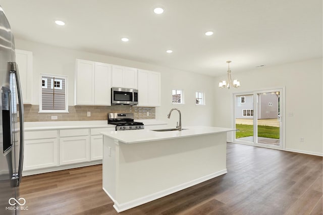 2712 Glade Ave, Plainfield, IN 46168 - kitchen with stainless steel appliances, a sink, decorative backsplash, dark wood-style floors, and recessed lighting