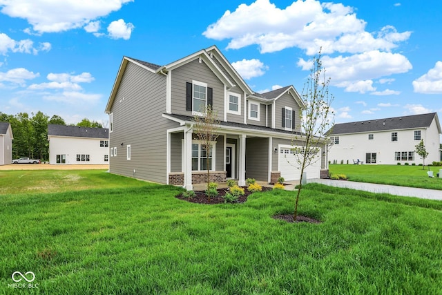 2712 Glade Ave, Plainfield, IN 46168 - view of front of house with covered porch, an attached garage, brick siding, and a front lawn