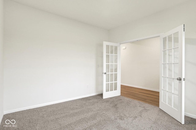 2712 Glade Ave, Plainfield, IN 46168 - unfurnished room featuring french doors, carpet, and baseboards